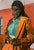 A mature innocent woman who has triumphed over the challenges of emotional trauma. Her serene yet strong presence, dressed...