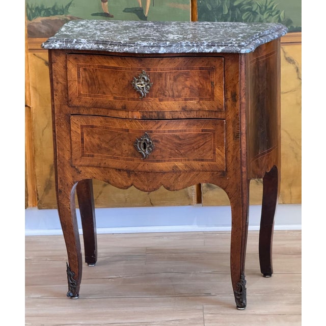 A 19th C. French bombe front kingwood commode with boxwood inlay and mottled gray marble The two shaped drawers have...