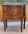 A 19th C. French bombe front kingwood commode with boxwood inlay and mottled gray marble The two shaped drawers have...