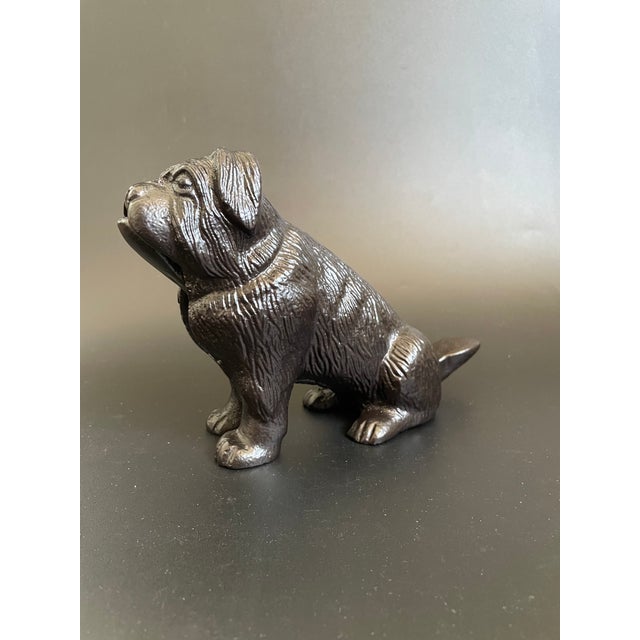 A vintage cast iron table nutcracker in the form of an English Bulldog, hand crafted with crisp, intricate detailing and a...