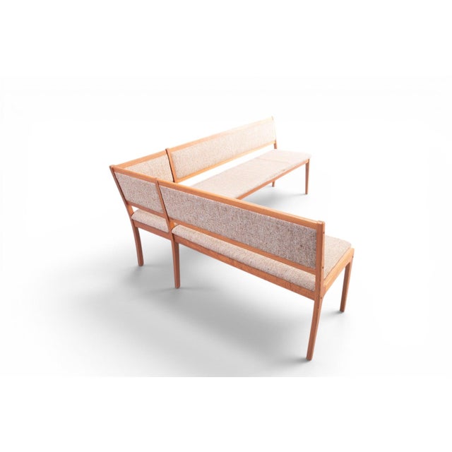 This Danish two-piece corner dining bench wraps a generous L-shaped seating run in warm teak and original wool upholstery,...