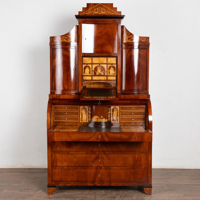 Early 19th-century Danish Empire secretary bureau crafted in mahogany veneer with both bowfront and concave cabinet doors....