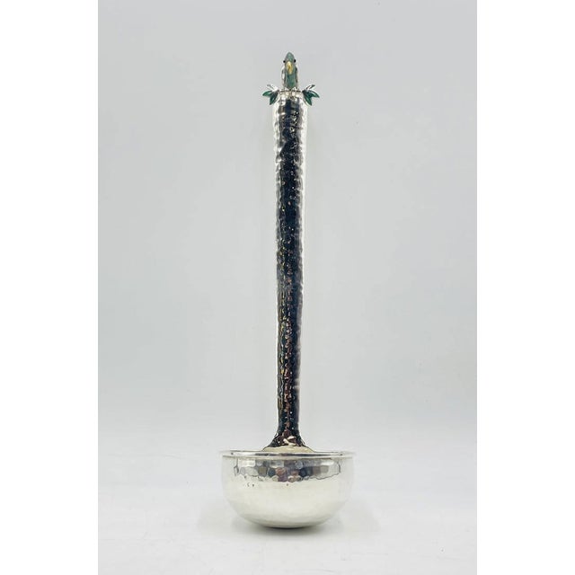 A whimsical and collectible silver-plated ladle designed and handcrafted in Taxco, Mexico by renowned designer Emilia...