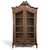 Graceful lines, warm walnut, and original beveled glass give this late 19th century French Louis XV display armoire a...