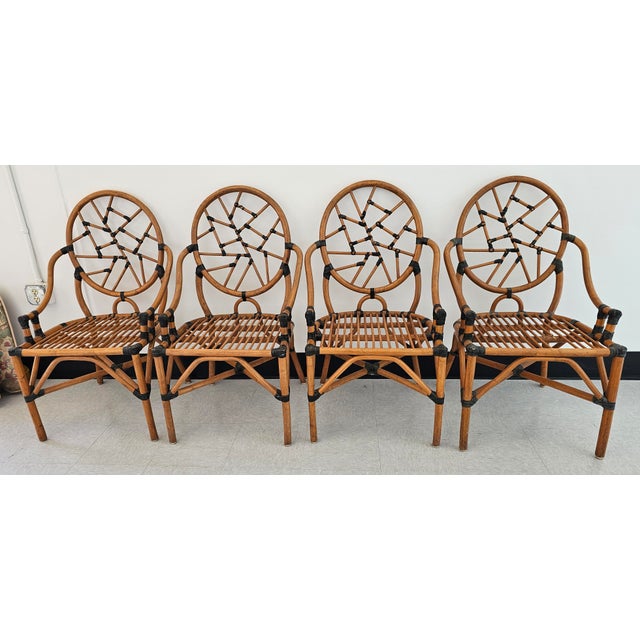Beautiful Set of Four McGuire Attributed Rattan and leather wraps "Cracked Ice" Dining Chairs. Measures 23" in width, 25"...