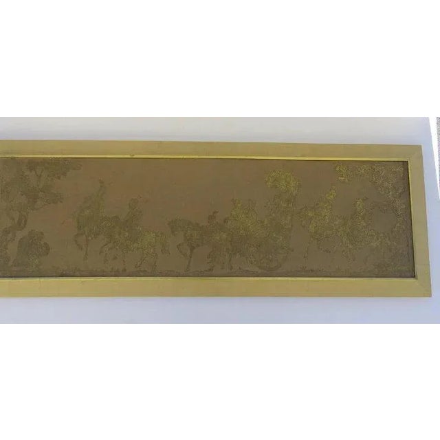 Good looking long gilt on fabric. Framed in fabric and border of wood gilt slip. Measures 54" by 19". Good size for a...