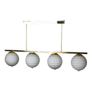 New Italian Fixture With 4 Pale Taupe Globes on Horizontal Brass Bar For Sale