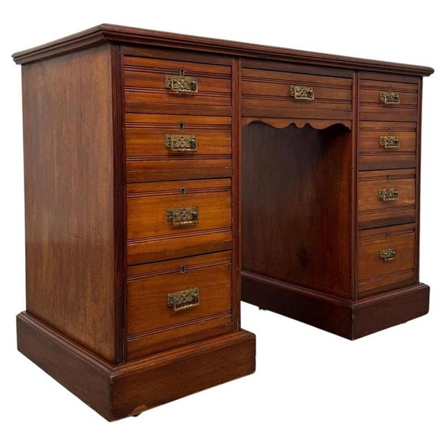 A handsome and beautifully proportioned early 20th-century Edwardian desk, crafted in richly coloured mahogany and...