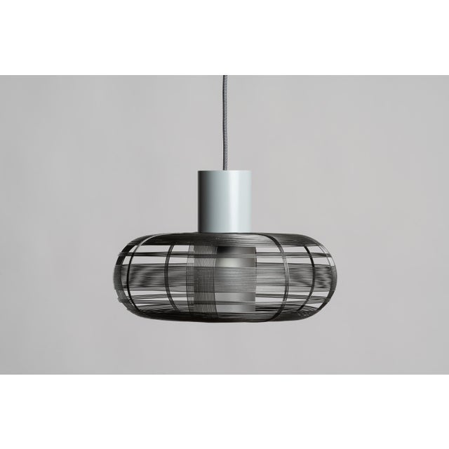 Handmade in the Philippines from galvanized iron wire, the Tubby Pendant showcases the malleable versatility that unifies...