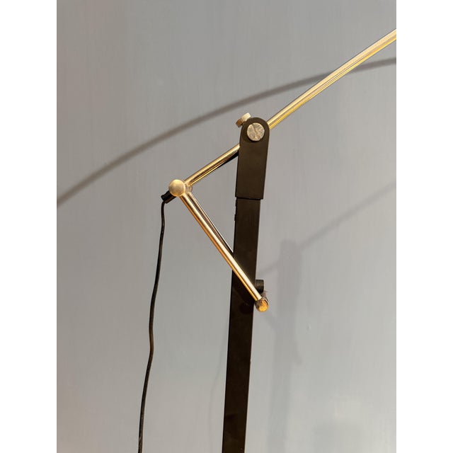 A charming original floor lamp from the 1970s, featuring a sleek and sophisticated design. The chromed metal frame with an...