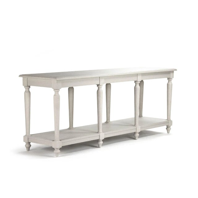 Console with shelf made of oak in distressed ivory finish.