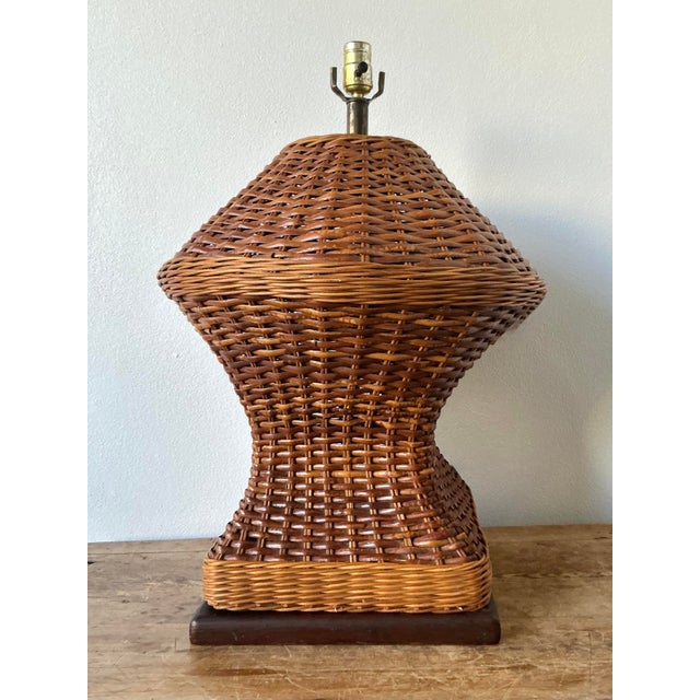 This monumental vintage table lamp is a masterful expression of Organic Modernism and the 1970s tropical-chic movement....