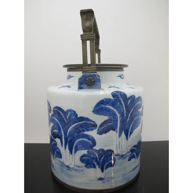 Qing Dynasty Chinese blue and white porcelain teapot with brass handle. Cylindrical teapot with round lid, hand-painted...