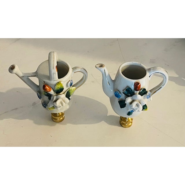 Antique porcelain small toy flower watering cans as lamp finials on brass bases. 2-3” each.