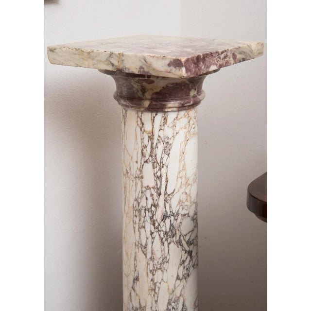 : Roman antique column in Fiordipesco marble belonging to the early 19th century. The base is quadrangular and is...