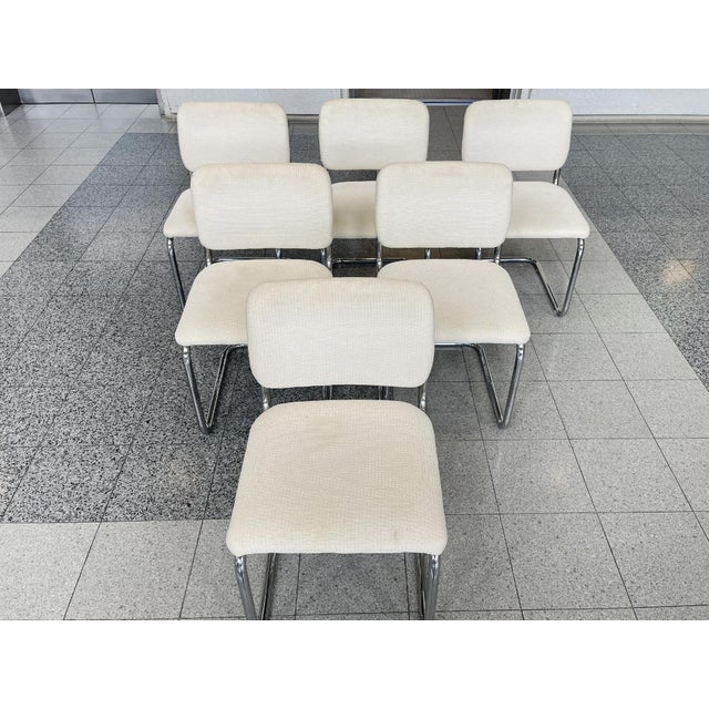 Modeled after the iconic Cesca chairs designed by Marcel Breuer, these 6 dining chairs consist of tubular chromed steel...