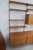 Practical and decorative wall shelf made of teak in good used condition. Dimensions: Total width: approx. 175 cm x depth:...