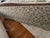 Beautiful vintage traditional three-seat sofa featuring a substantial exposed wood frame, elegant rolled arms, loose seat...