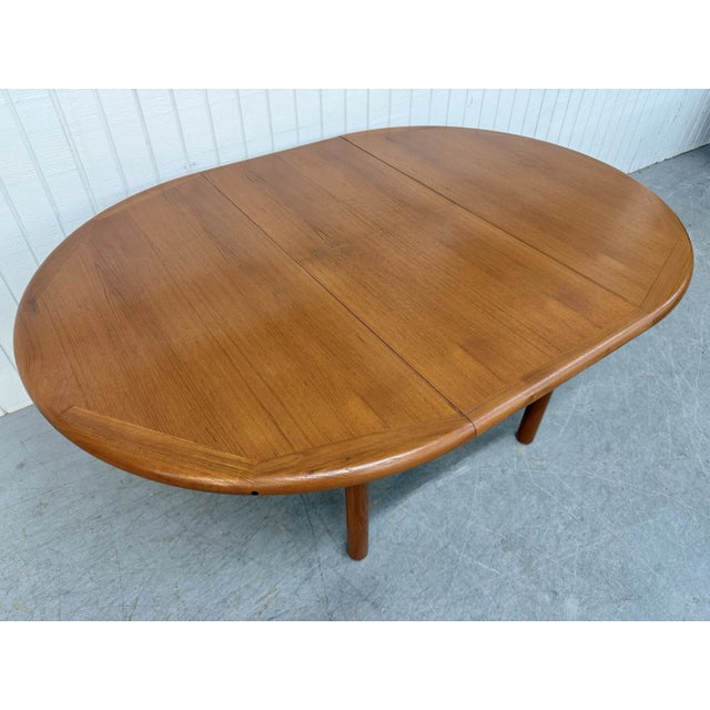 This listing is for a Mid-Century Danish Modern Teak Dining Table. Featuring a 48” round top, hidden pop-up leaves that...