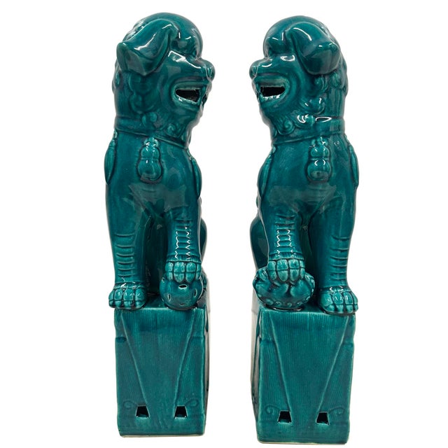 This magnificent pair of Chinese Green Glazed Ceramic Lion Statuary are hand made and hand carved in Museum quality....