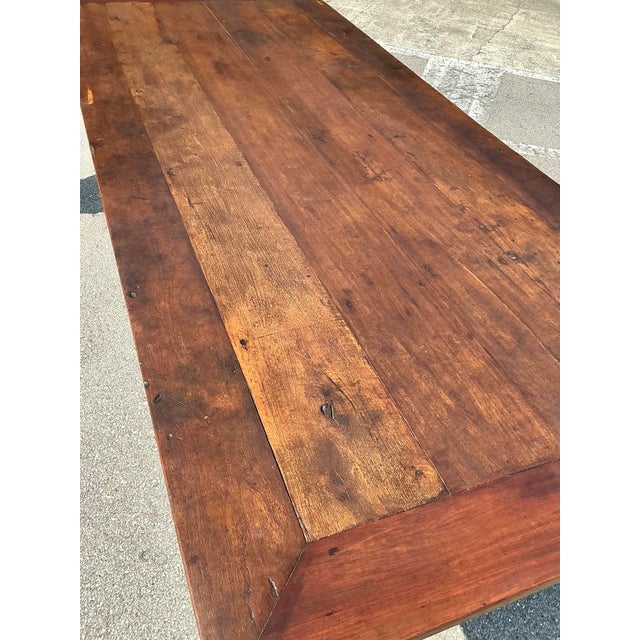 This monumental 18th-century style trestle dining table is a masterclass in rustic grandeur, evoking the soulful charm of...