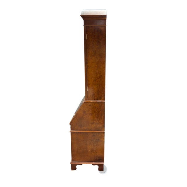 Monumental Italian-made secretary desk cabinet crafted with richly figured radica burl veneer and elegant neoclassical...