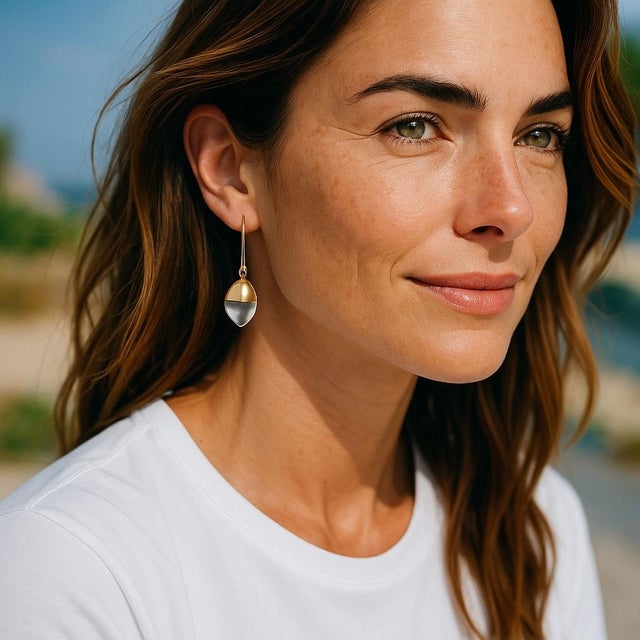 A Modern Touch of Italian Glamour Enhance your jewelry collection with these Emporio Armani 18K Gold and Crystal Pendant...