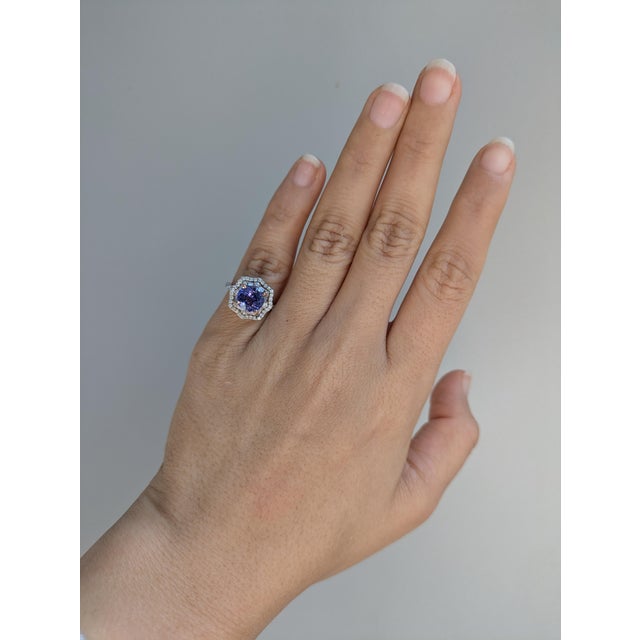 A breathtaking masterpiece of luxury and elegance. Featuring a dazzling 2.44-carat tanzanite at the center, this round-cut...
