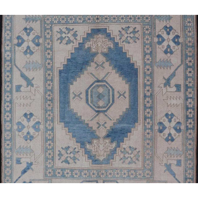 Oushak vintage rug from Turkey with Geometric medallion in various blue tones, Light blue and ivory, Keivan Woven Arts/rug...