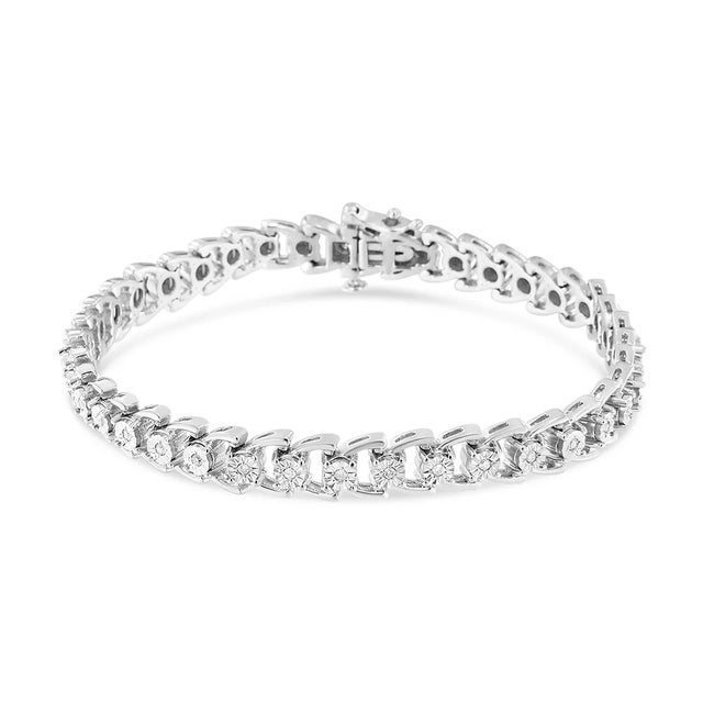 Wrap your wrist in sparkling splendor with this sensational diamond composite open linked composite line bracelet. The...