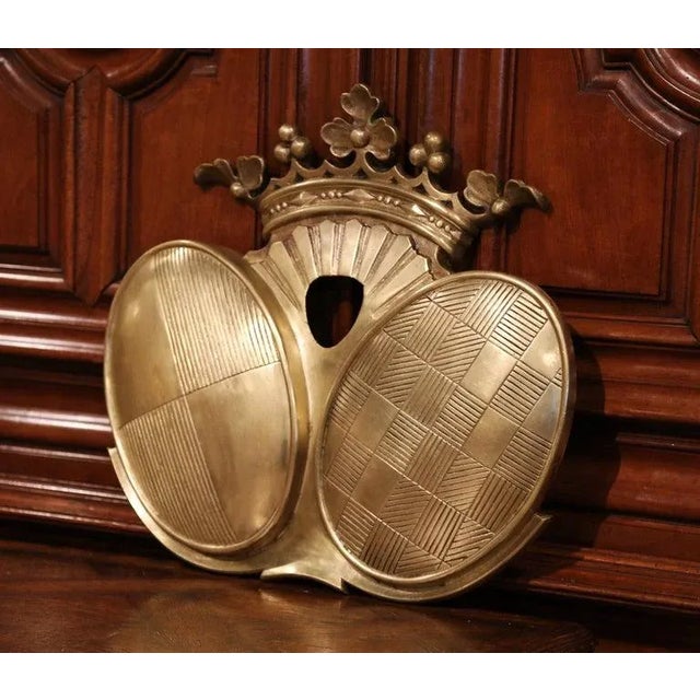 Decorate an office or a study with this elegant antique bronze coat of arms. Crafted in France, circa 1880, the large...