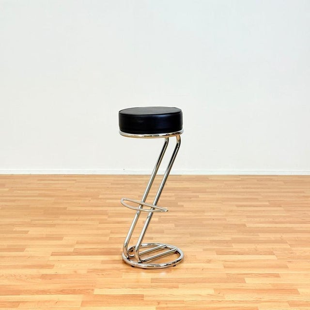 Pair of barstools manufactured in Italy in the 1990s by C. Nilsson for Effezeta, model "Zeta". The chairs are made of...