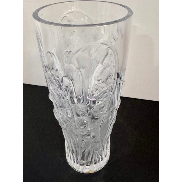 Elegant Lalique Elves clear crystal vase featuring a molded botanical and bird motif around the body. Base is signed...