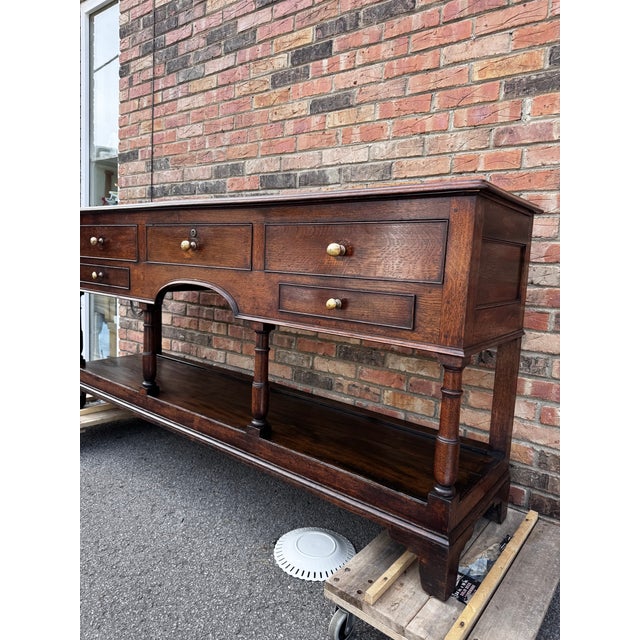 This is an attractive 18th Century, George III Period Oak Dresser base with rectangular top over 5 drawers with elegant...