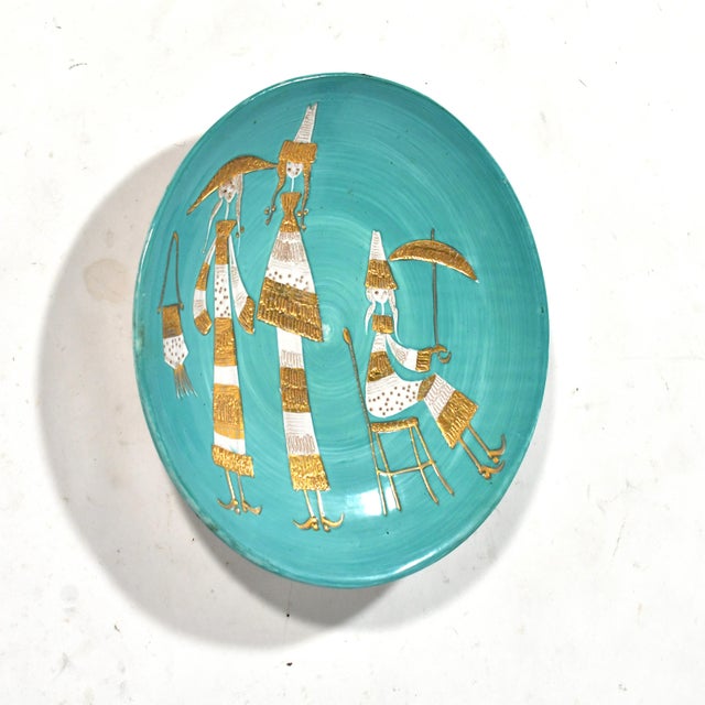 Likely by Fratelli Fanciullacci, this large and dramatic platter or charger has a vivid turquoise background surrounding a...