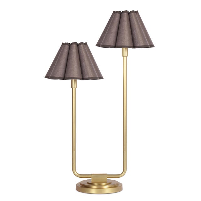 An imaginative twist on a classic style, the Polly Double Arm Table Lamp reaches upward with twin scalloped shades that...