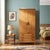 1960s oak wardrobe featuring a functional and linear design typical of the period. The structure includes two hinged doors...