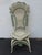 This exquisite Victorian late 1800's Side Chair is made of woven wicker or rattan, painted primarily in an off-white color...