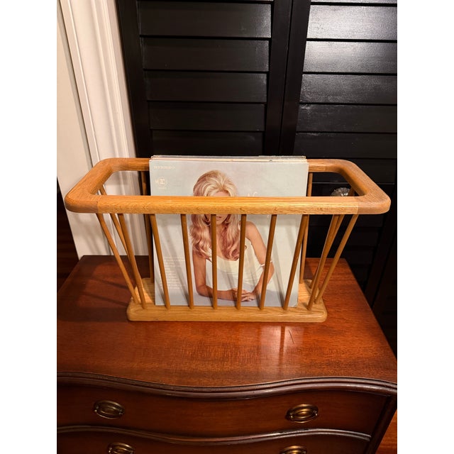 Vintage Scandinavian-magazine rack crafted from solid oak with a beautifully sculpted silhouette. Perfect for storing up...