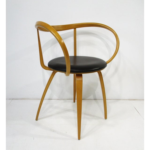 A very well-crafted sculptural bentwood Pretzel chair with dark brown upholstered leather seat cushion. This unique and...