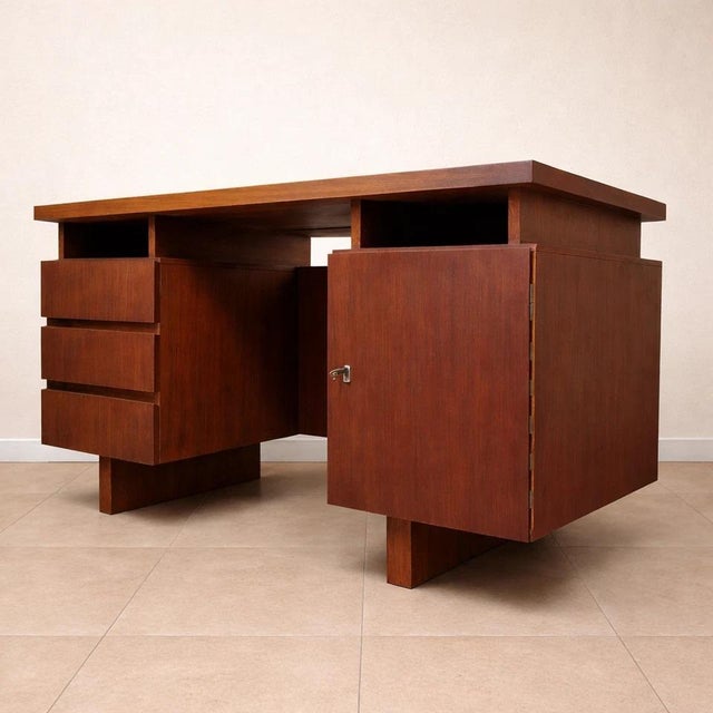 Scandinavian Teak Center Desk, Circa 1960 This beautiful Scandinavian teak center desk, dating from the 1960s, boasts a...