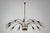 Striking Italian Mid-Century chandelier from the late 1950s featuring a dynamic Sputnik design with multiple curved arms...