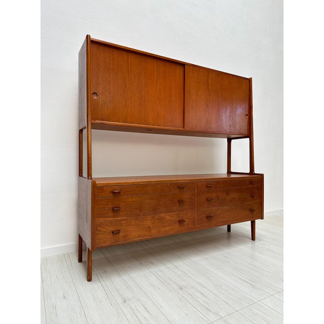 The ry20 highboard, designed by hans j. Wegner in the early 1950s for ry møbler, is a refined example of danish modern...