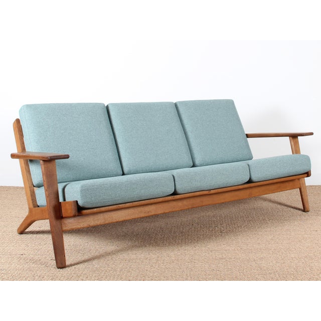 - Scandinavian 3-seater sofa designed by Hans Wegner in 1959 - Produced by Getama during the late 1960s - Features a...