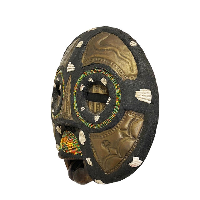 Vintage West African Ashanti Ghana hand carved round wooden moon mask inlaid with geometric brass pieces, glass beads and...
