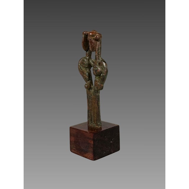 Idol, Amlash, Early 1st Millennium BC, Bronze Bronze group depicting two intertwined figures Bronze with a red and green...