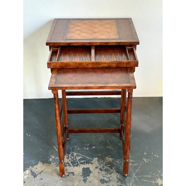Crafted by Theodore Alexander, this elegant set of vintage wood nesting tables exemplifies the brand’s dedication to...