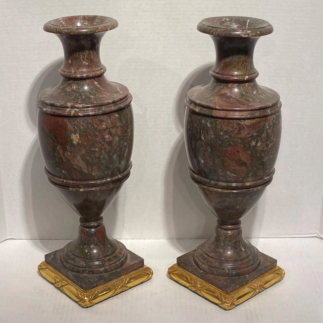 Pair of 19 century Italian neoclassical Rouge marble vases on later giltwood bases.