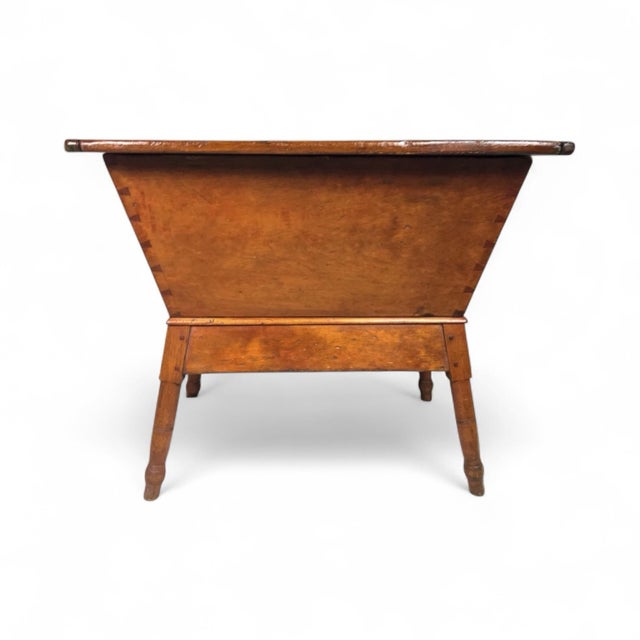 This is an excellent very early Southern pine dough box on stand with its original lid. The lid and angle of the box were...