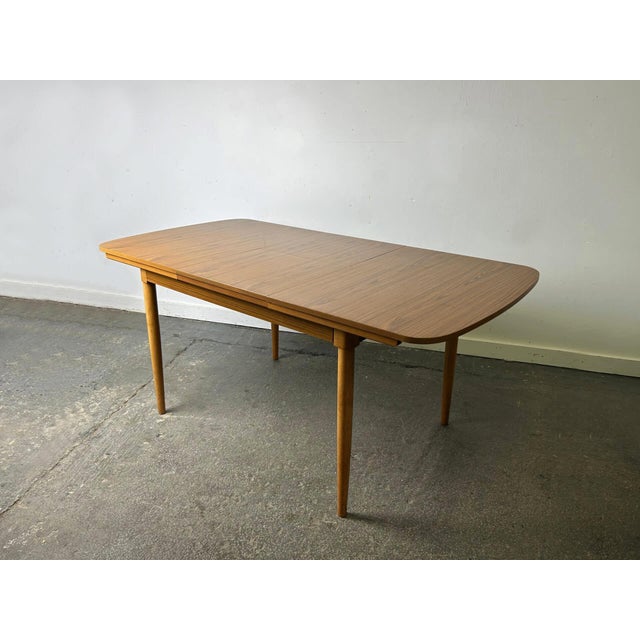 A mid-century extending dining table by Schreiber — one of Britain’s most recognisable post-war furniture brands, whose...